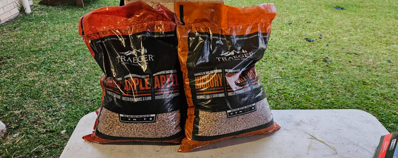 Bags of apple and hickory smoking pellets